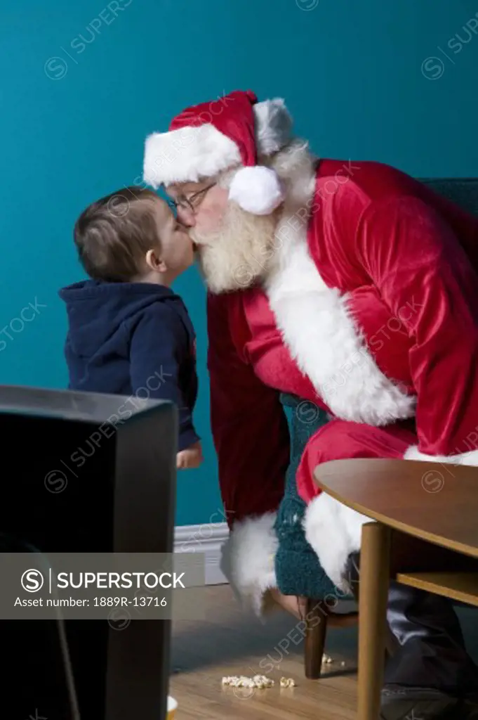 Kisses from Santa for a little boy