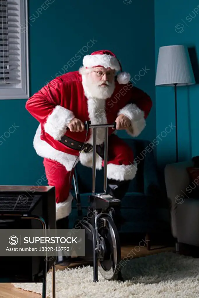 Santa riding stationary bike