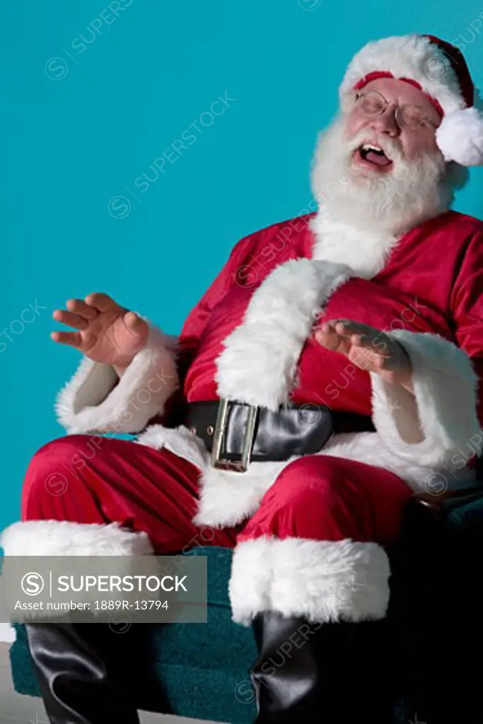 Santa sitting and laughing