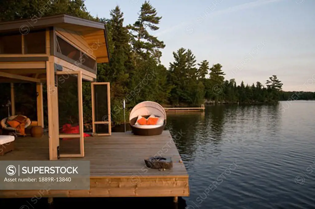 Lake of the Woods, Ontario, Canada; Lounge chairs on dock