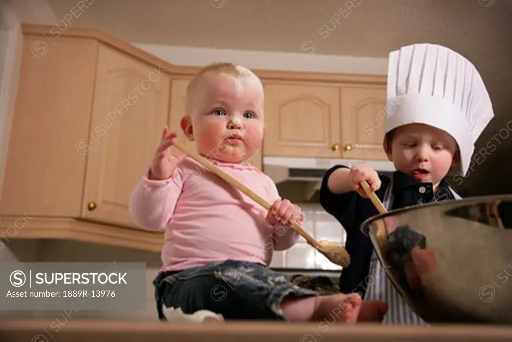Children playing in the kitchen  