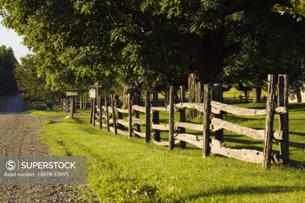 Rural road with wooden fence