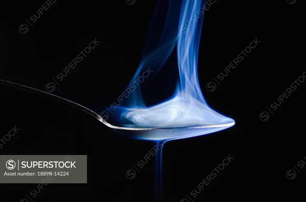 Smoke rising from a spoon