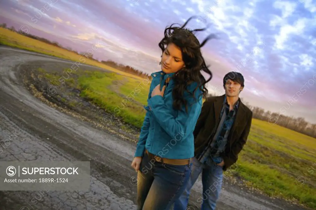 Young man and woman on a road