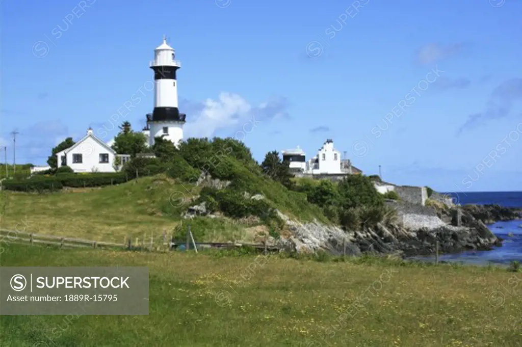 Shrove Lighthouse, Greencastle, Co Donegal, Ireland; View of beach and lighthouse