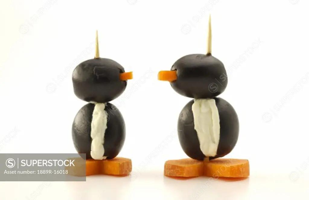 Penguins made of olives, cream cheese and carrots; Appetizers