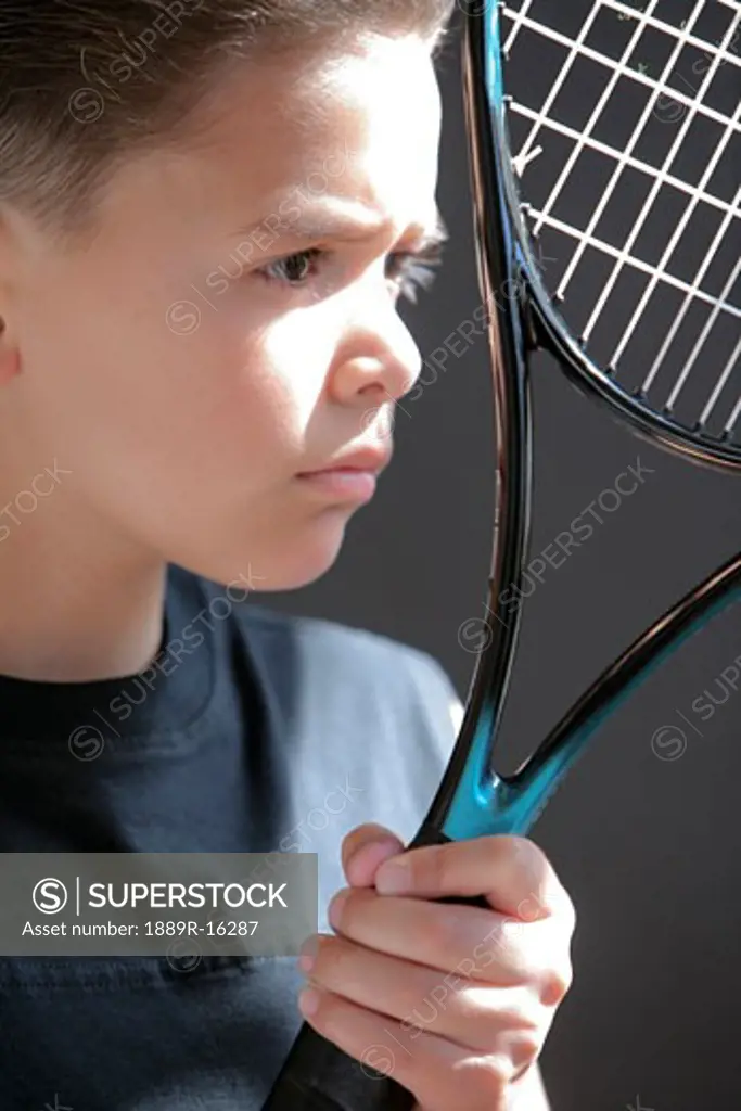 Boy holding racquet