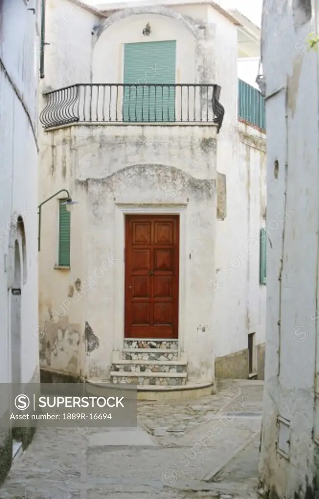 Capri, Italy; Red doorway and narrow street of Capri