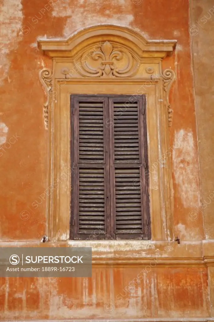 Rome, Italy; One window with shutters