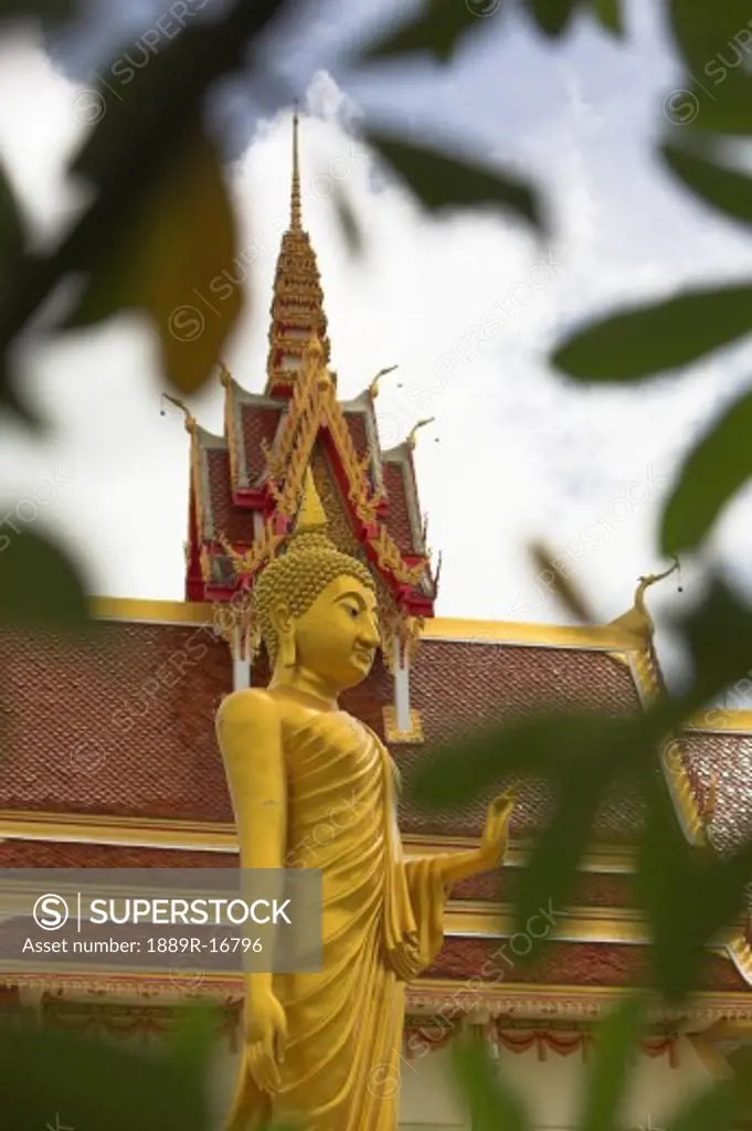 Isan, Thailand; Buddha and temple  