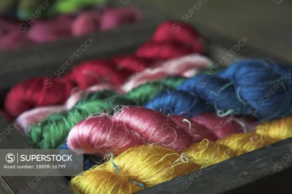 Ban Tha Sawang, Thailand, Asia; Colorful silk weaving  