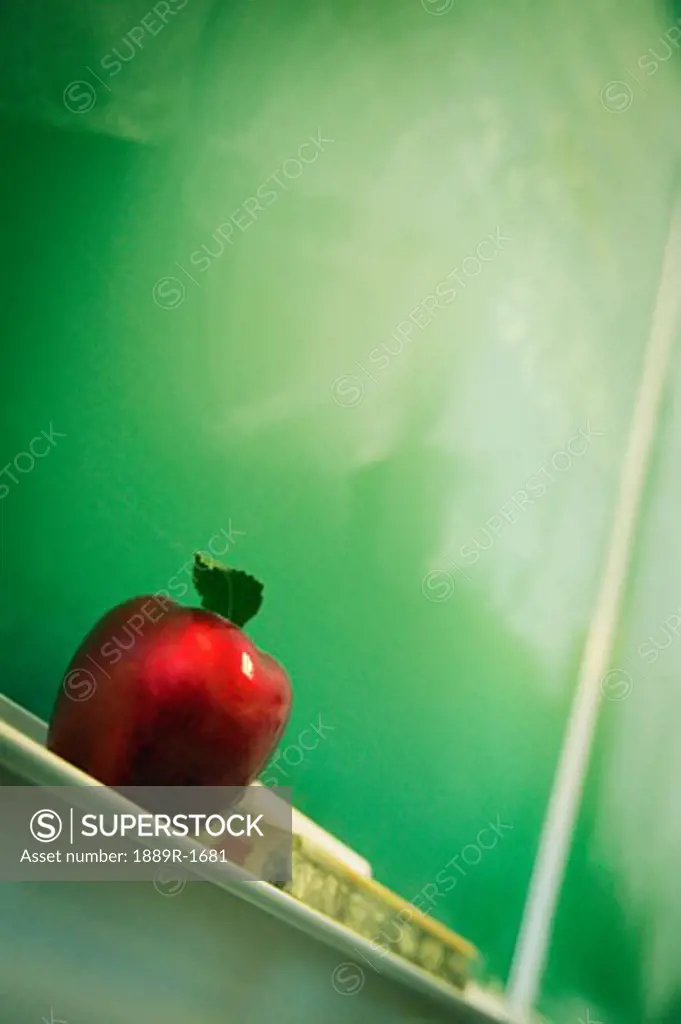 Apple sitting on chalkboard