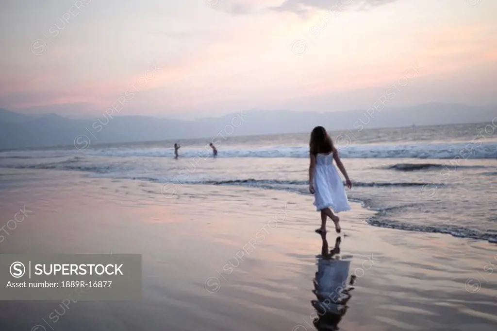 Puerto Vallarta, Mexico; Girl walking on the beach  