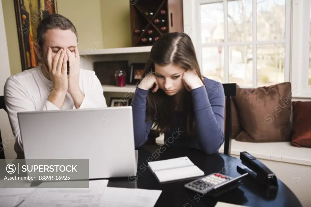 Young couple with financial stress