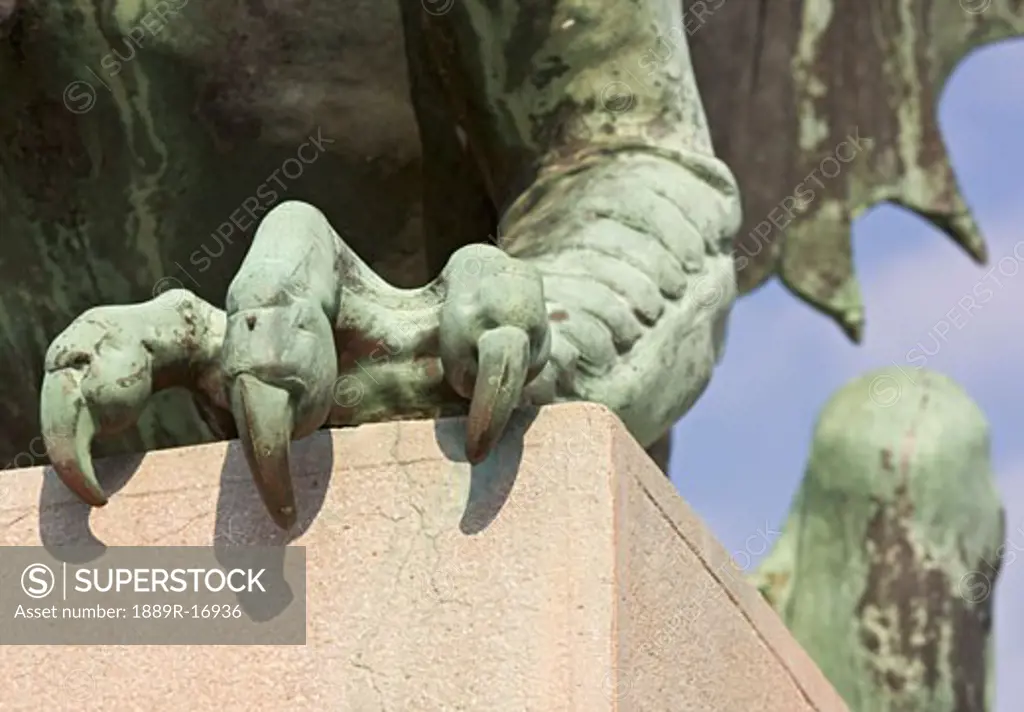 Ljubljana, Slovenia; claws on one of the green copper dragon statues on Zmajski (Dragon Bridge)