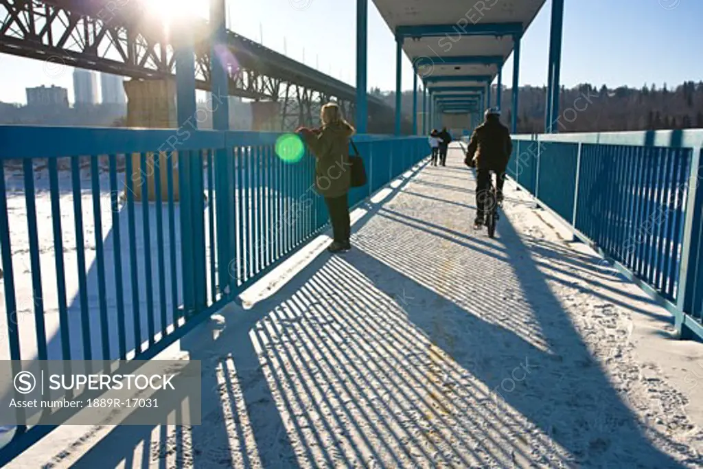 Edmonton, Alberta, Canada; People on a walking bridge