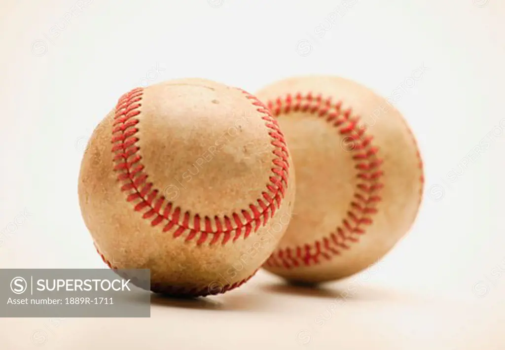 Two dirty baseballs
