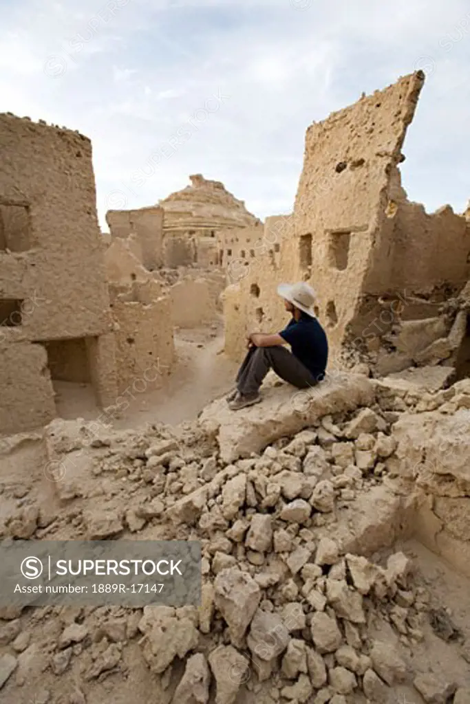 Siwa, Siwa Oasis, Egypt; Man overlooking Fortress of Shali