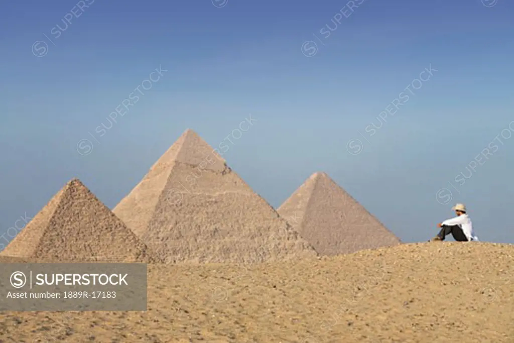 Cairo, Giza, Egypt; Tourist viewing the Pyramids of Giza