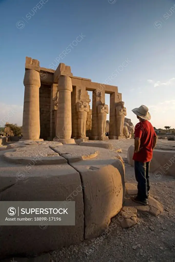 Luxor, Egypt; The Ramesseum, A tourist enjoying the view