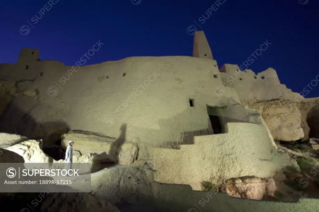 Siwa Oasis, Egypt; A local Siwan young man in traditional dress at the Temple of the Oracle
