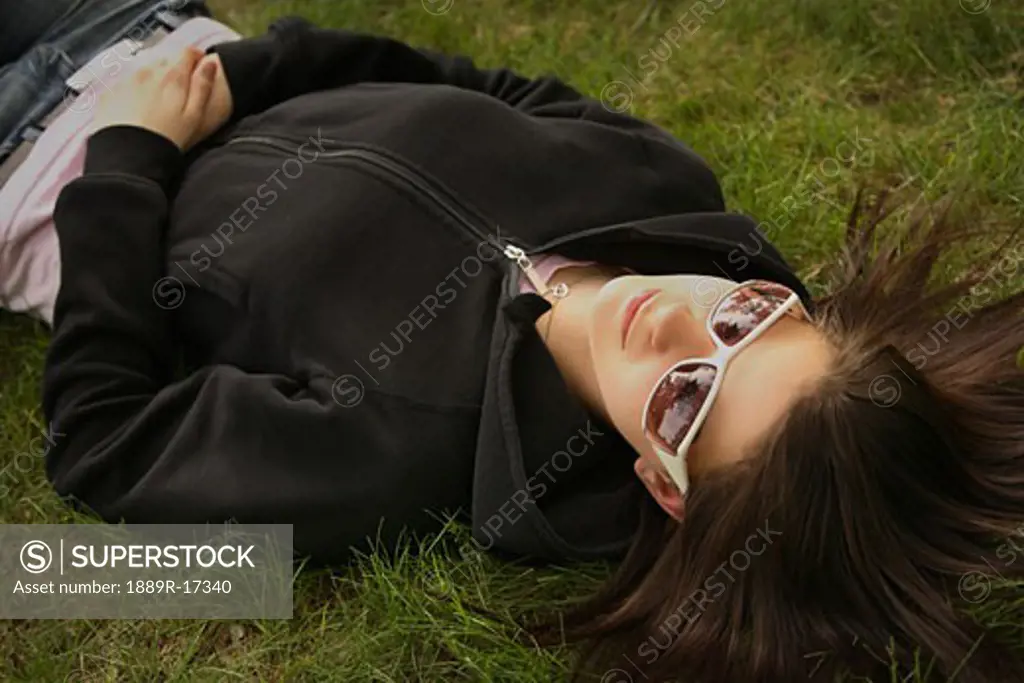 Woman lying on the grass