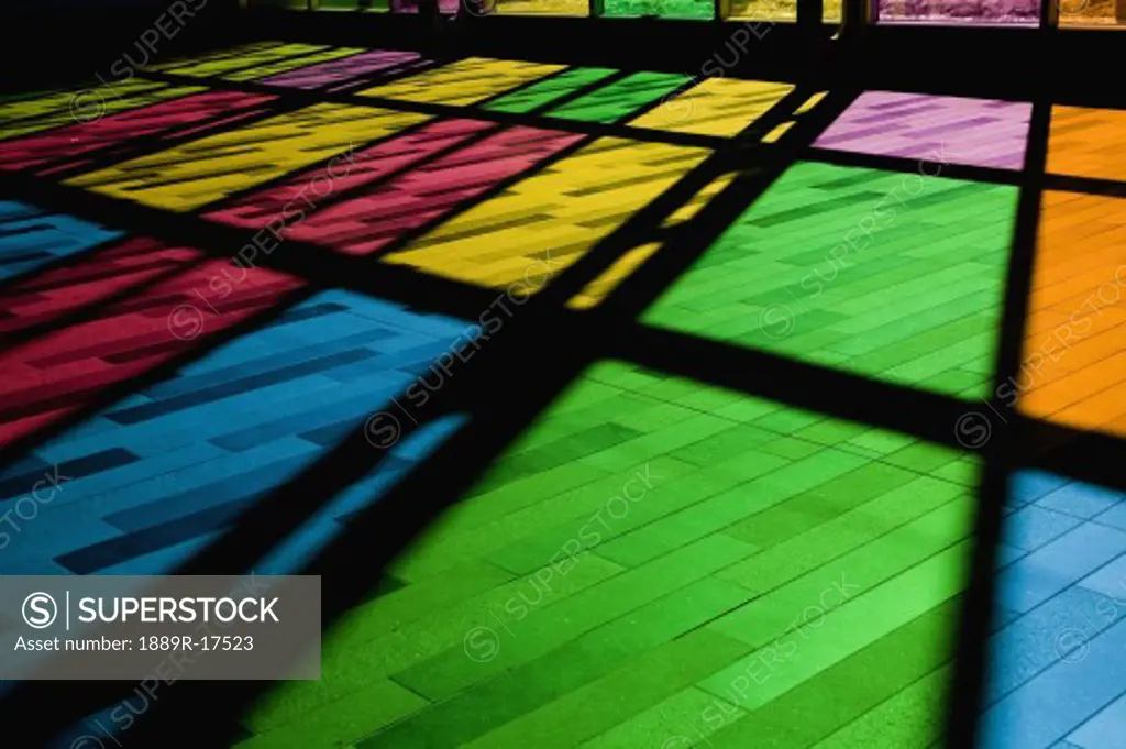 Colorful windows; Reflection of stained glass window on the floor