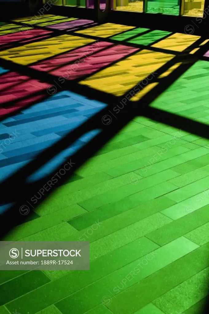 Colorful windows; Reflection of stained glass window on the floor