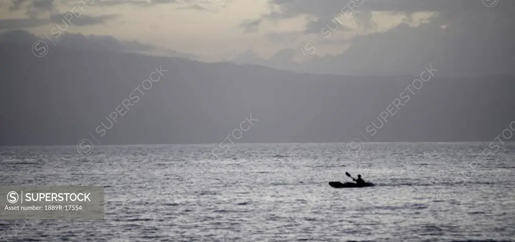 Maui, Hawaii, USA; Kayaker on the ocean  