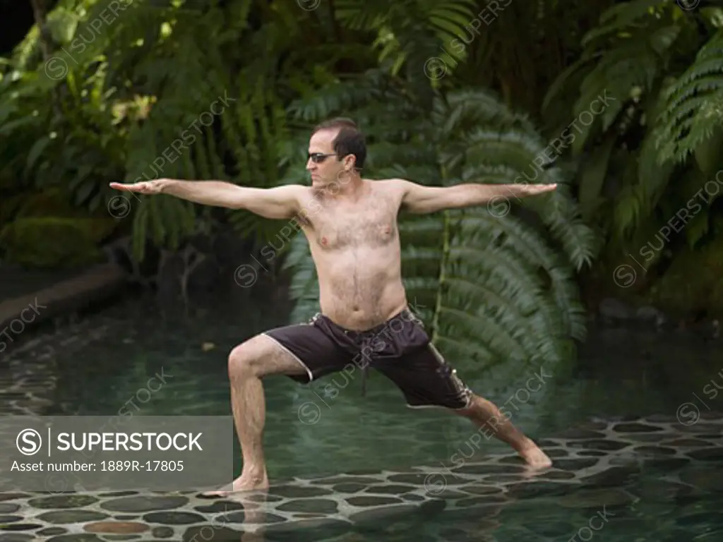 Como Shambhala Estate, Bali, Indonesia; Man in yoga position
