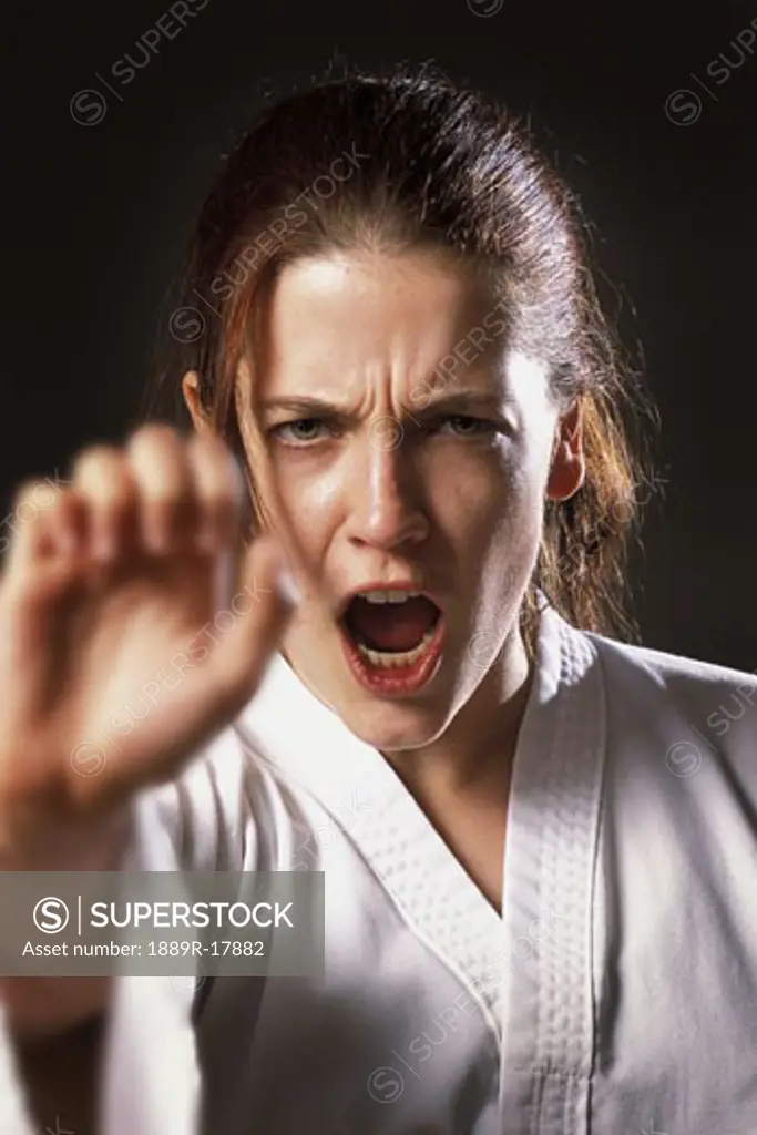 Woman doing a karate punch