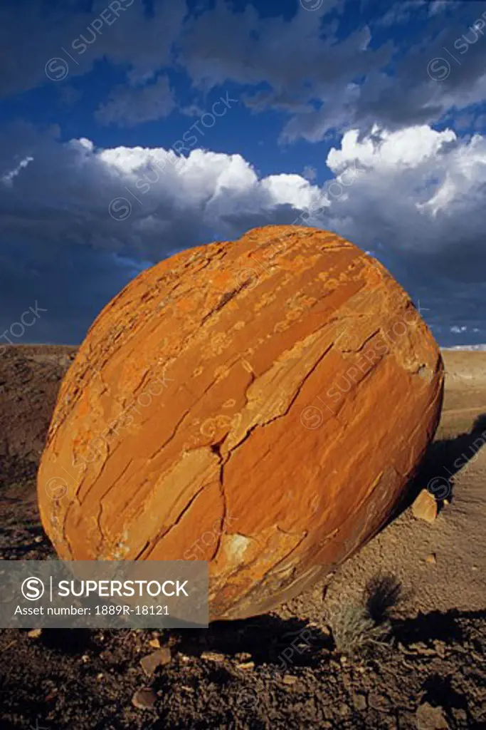 Large red boulder in desert valley Red Rock Coulee Alberta