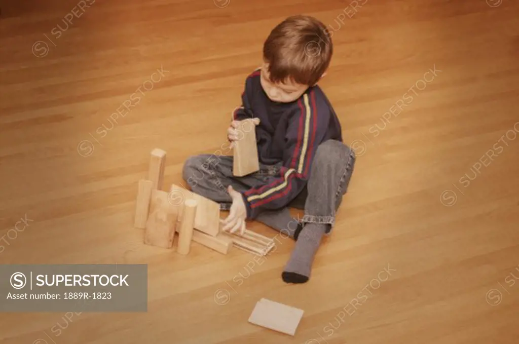 Child plays with blocks