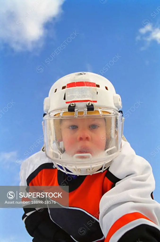 Young boy in hockey gear