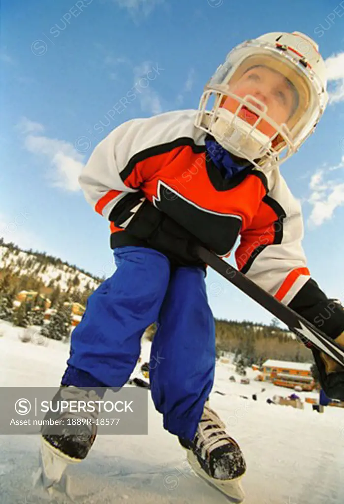 Young boy in hockey gear