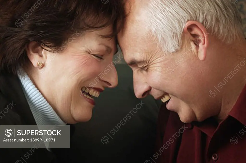 Married couple laugh together