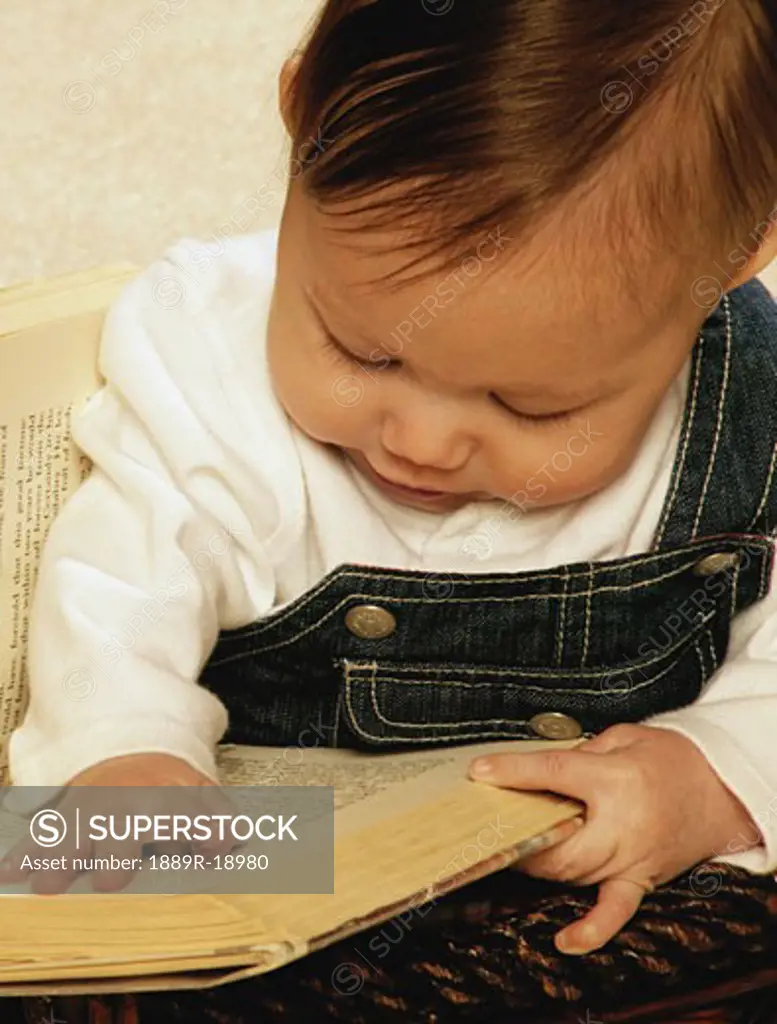 Baby reading a book