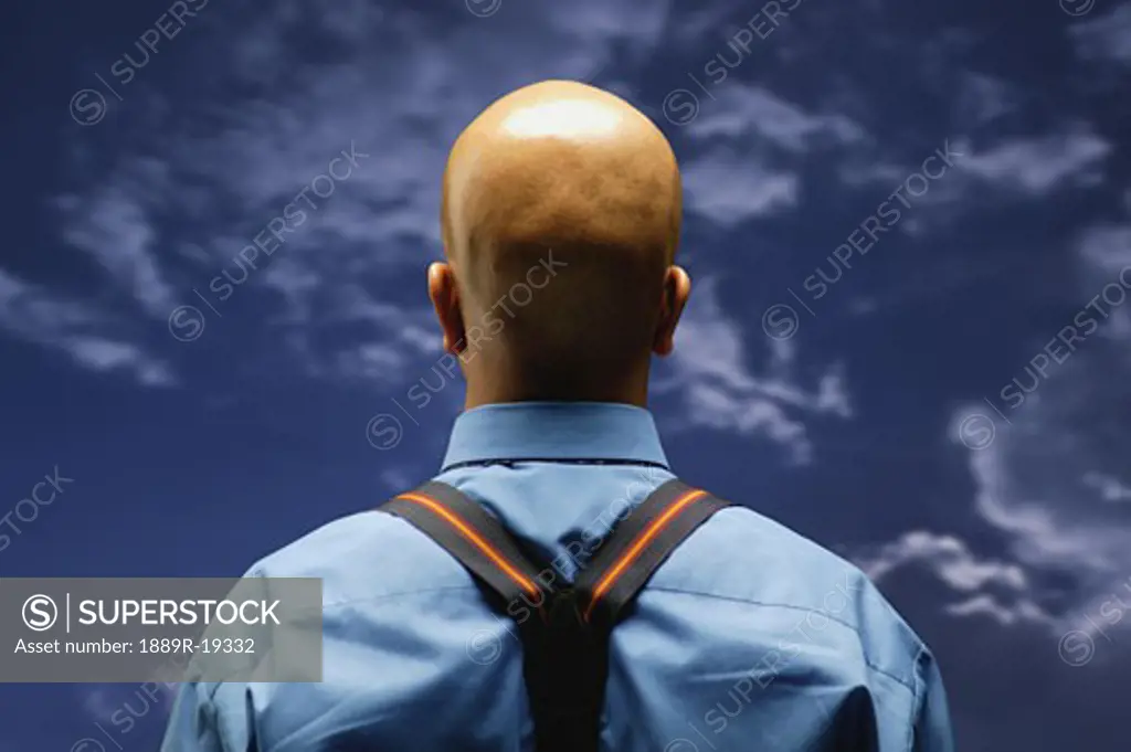 Man looks at the sky