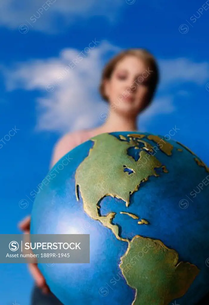 Caucasian woman holding globe