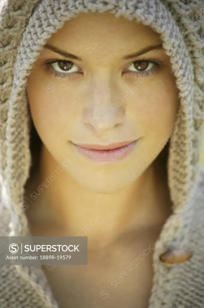 Woman wearing a knit hoodie