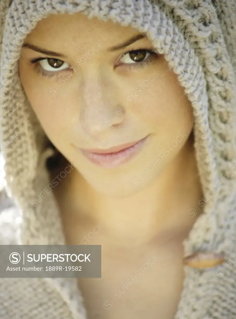 Woman wearing a knit hoodie