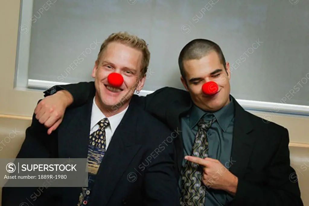 Two Businessmen being silly wearing red noses