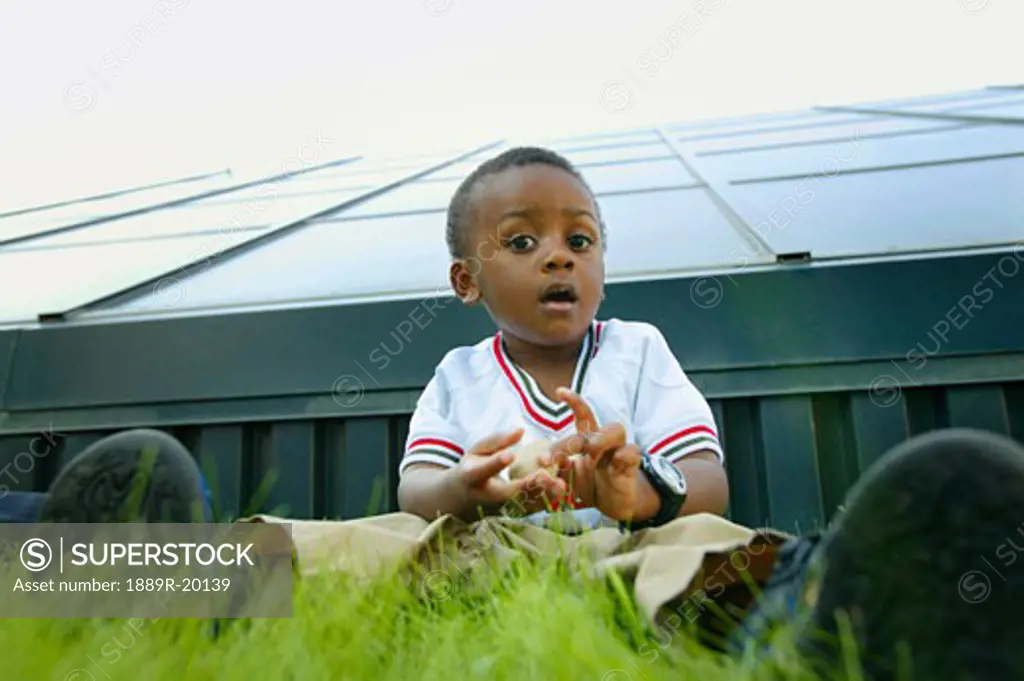 Child sitting on the grass