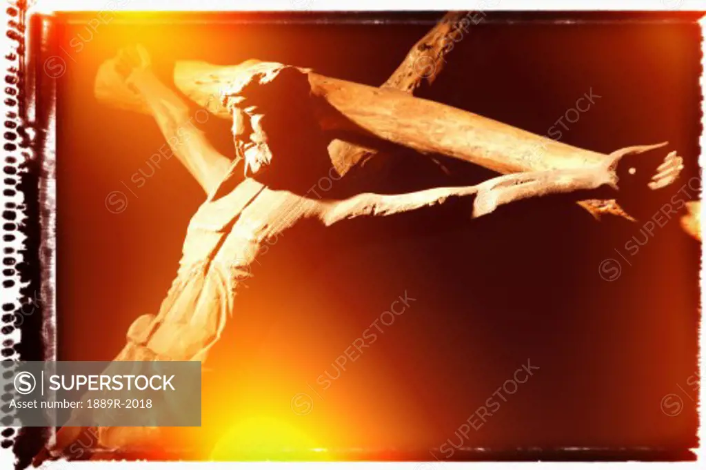 A wooden carving of Jesus on the cross