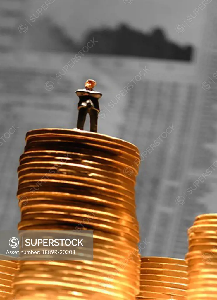 Man standing on a stack of money
