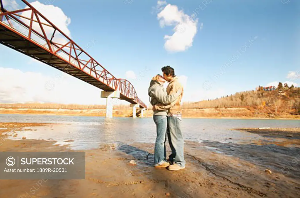 Couple kiss in river valley