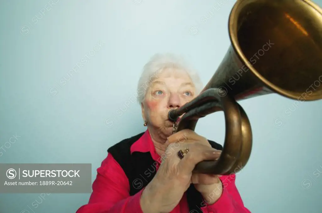 Woman plays horn