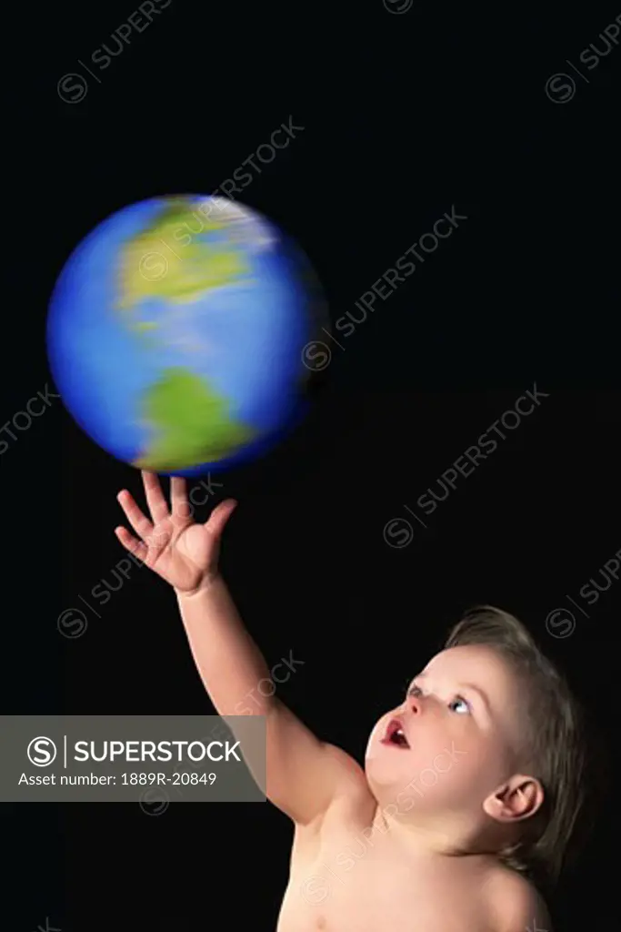 A child with the world at his fingertips