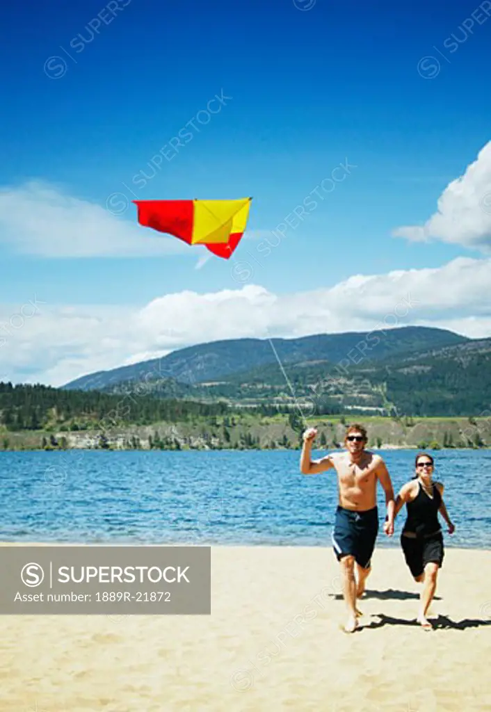 A couple fly a kite