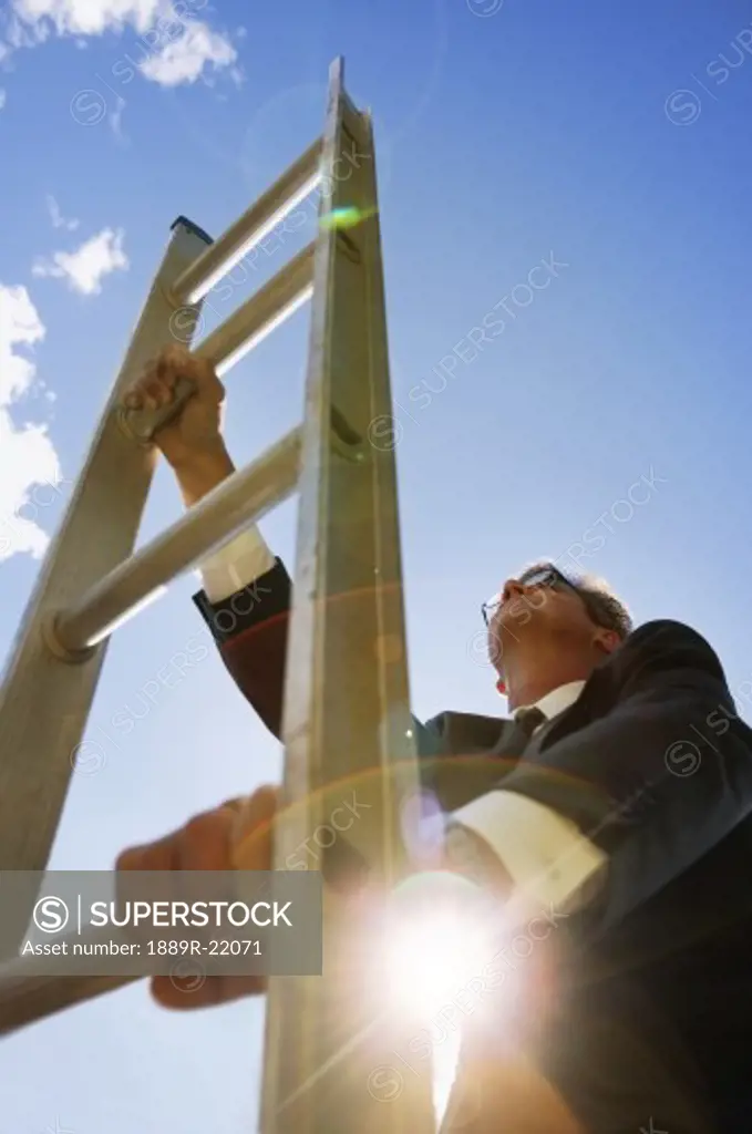Businessman climbs the corporate ladder